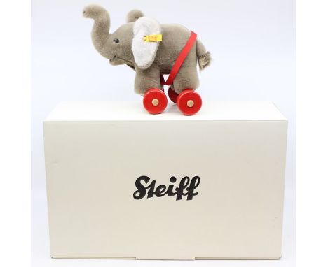 Steiff: A boxed Steiff, Elephant on Wheels, 048784, height approx. 7"; together with a boxed Rainbow Designs, The World of Be