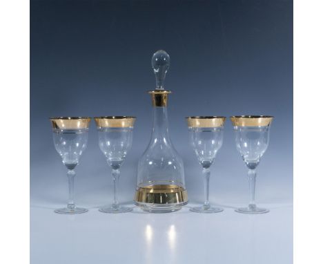 Elegant gilded stemware set and carafe with stopper. Glasses: 3.75"W x 8"H. Decanter: 5"L x 10.25"H. Dimensions: See Descript