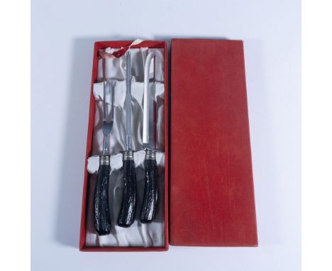 Three pieces of kitchen carving tools with black ridged handles. Knife: 12.5"L x 1.5"W x 1"H. Meat fork: 10.5"L x 1.5"W x 1"H