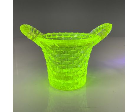 Pressed Uranium glass into the shape of a basket with basket weave pattern and two handles. Boyd's B backstamp to base. Fluor