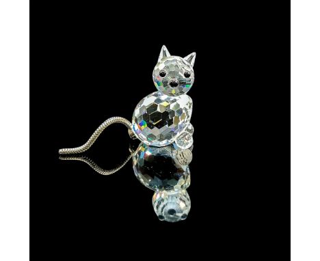 Clear faceted crystal figure of a cat with a metal tail. Swarovski mark. Item number 7659NR031000. Part of the Pets Corner co