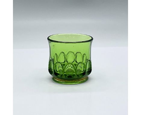 Gold is edged around the base of this toothpick holder. Made of green glass in the early 20th century. Faint etching says "So