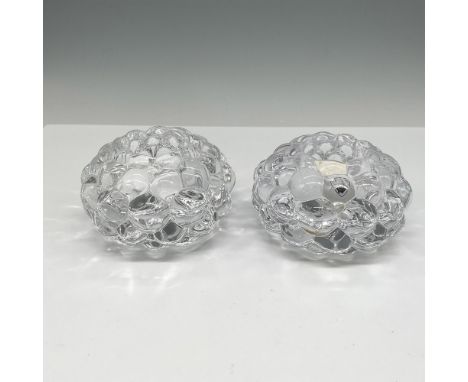 Crystal design of stacked drupelets creates these visually soft and appealing holders. Orrefors mark. 6475762. This item has 