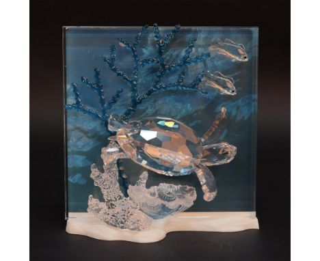 Lead crystal figural grouping of a turtle and two fish amongst coral and sea plants. This item has its original box which mea