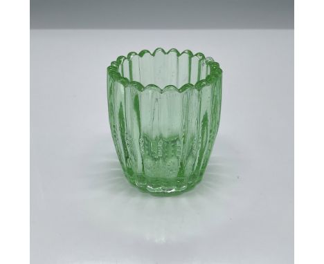 Elegant light green glass pressed into ribbed side design and starburst at the base. Issued: 20th centuryDimensions: 2.5"H x 