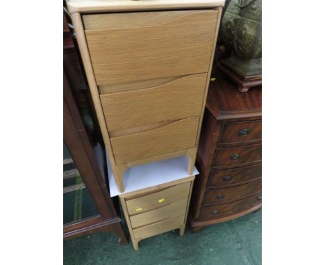 PAIR OF ERCOL LIGHT WOOD THREE-DRAWER BEDSIDE CHESTS.