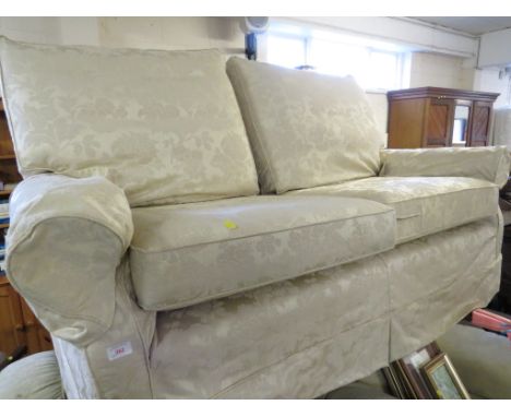 MULTI YORK TWO-SEATER SOFA WITH BEIGE FLORAL COVERS.