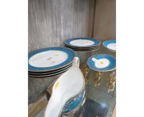 ELEVEN MINTON CHINA DINNER PLATES DECORATED IN THE STYLE OF CHRISTOPHER DRESSER, WITH BLUE GILT BORDERS, ENAMELLED MONOGRAMS 