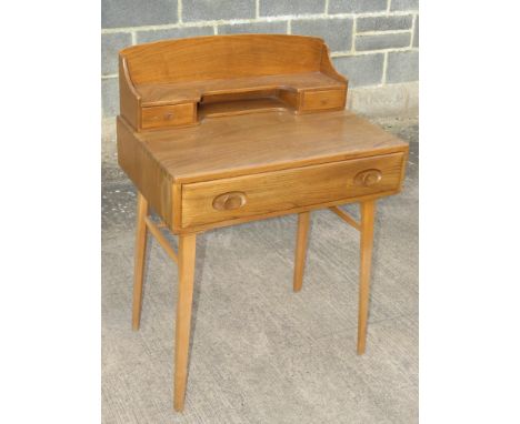 ERCOL LIGHT ELM WRITING DESK WITH TWO SMALL DRAWERS TO TOP SECTION AND SINGLE DRAWER BENEATH, STANDING ON TAPERING LEGS