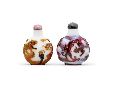 Two overlay decorated milky-white glass snuff bottles19th centuryThe first with applied dual-overlay in caramel and black gla