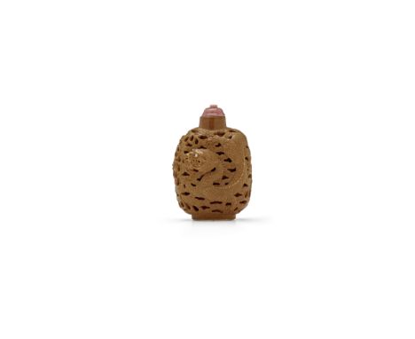 A CARVED OPENWORK BROWN ENAMELED PORCELAIN 'DRAGON' SNUFF BOTTLEWang Bingrong, 1820-1860Of rounded rectangular form, carved w