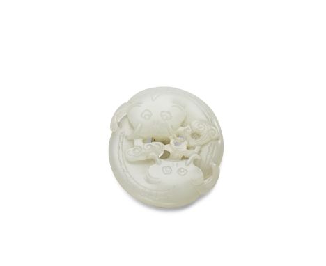 A white jade carving of two catfishQing dynastyOf circular form and thin section, carefully worked  as two carp heads facing 