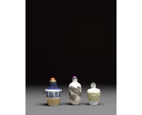 Three porcelain snuff bottles19th/early 20th centuryIncluding a blue and white baluster form bottle surmounted with a pair of