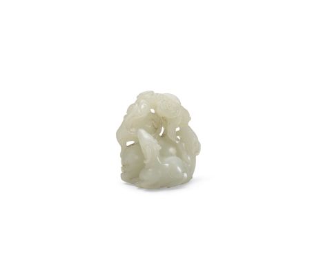 A carved jade figural group of three rams18th/19th centuryThe adult and two kids seated in a close group beneath reticulated 