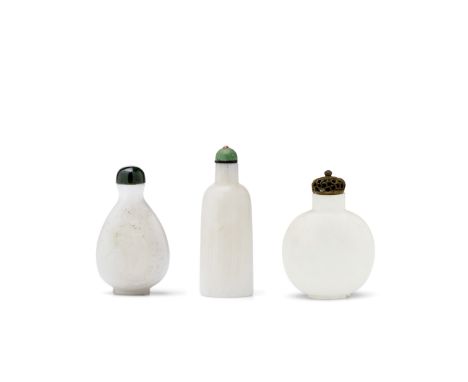 THREE ARAGONITE SNUFF BOTTLES1780-1880The first of flattened pear shape, carved in low relief, one side with a pair of magpie