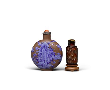 Two snuff bottlesAmber bottle: 19th/early 20th centuryThe first a rounded Yixing bottle standing on a thin oval foot ring, it