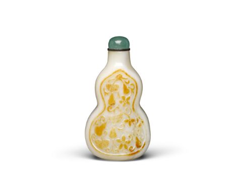 A white jade 'double-gourd' snuff bottle20th centuryVery well-hollowed, the double-gourd form bottle carved through the russe