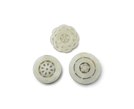 Three jade circular plaques undercut with movable roundelsLate Qing/Republic periodThe first of thick section, the outer ring