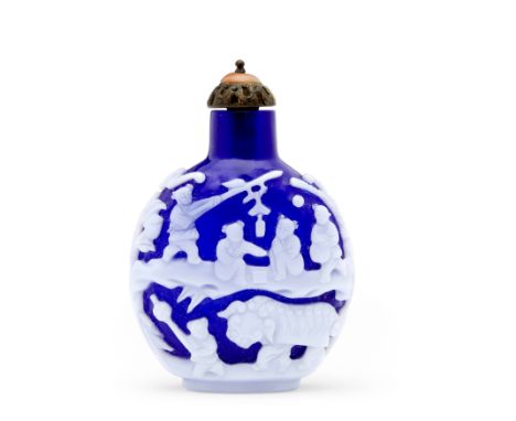 A WHITE OVERLAY BLUE GLASS 'HUNDRED BOYS' SNUFF BOTTLE1800-1880Of flattened rounded form rising to a gently tapered neck with