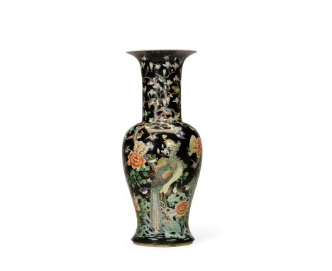 A famille noire enameled 'phoenix tail' vase19th centuryPotted with a trumpet neck rising from a baluster-form body, painted 