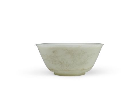A carved jade bowlRepublic periodThe slightly flared rim surmounting the thinly sectioned sides incised in a continuous table