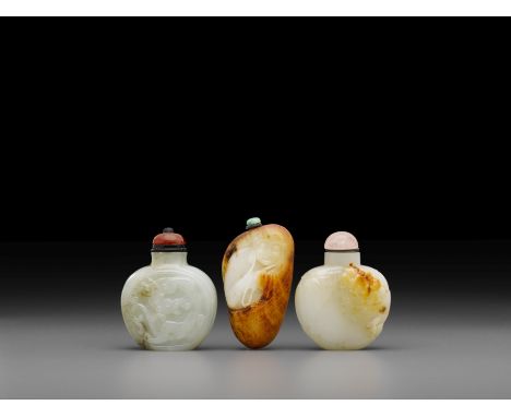 Three carved jade snuff bottlesThe first a well-hollowed grayish-white bottle, each broad side with a conforming reserve fram