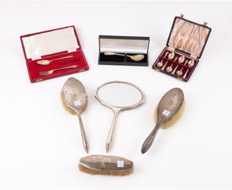 A GROUP OF SILVER MOUNTED DRESSING TABLE WARES AND A SMALL GROUP OF SILVER FLATWARE  (7)Comprising; a hand mirror and a hairb