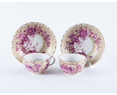 A RARE PAIR OF CHAMPION'S BRISTOL TEACUPS AND SAUCERS (4)Circa 1770Painted in Meissen style with purple wheat sheaves and flo