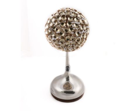 A MODERNIST SILVER SCULPTUREOf abstract form, the top being a sphere of miniature dish shaped motifs, raised on a tapered cir