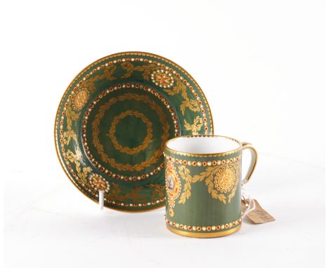 A SEVRES `JEWELLED' GREEN-GROUND CABINET CUP AND SAUCERThe porcelain 18th century, the decoration probably laterEach decorate