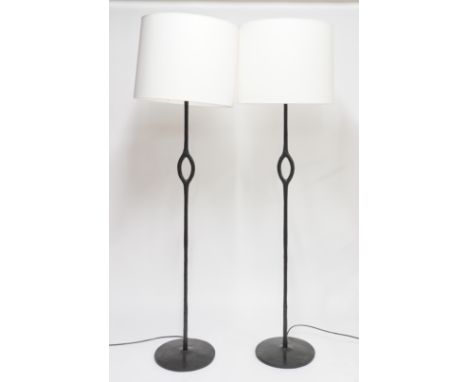 CHRISTIAN LIAIGRE (FRENCH 1943-2020); A PAIR OF BLACK PATINATED CAST-BRONZE ‘AMANDE’ FLOOR STANDING LAMPS (2)With monogram to