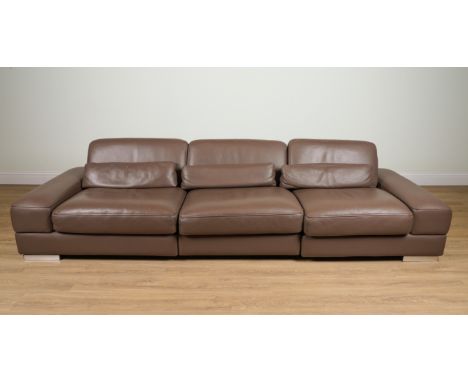 ROCHE BOBOIS; A BROWN LEATHER UPHOLSTERED TRIPLE SECTION SOFAOn block chrome supports, 298cm wide; 70cm high; 105cm deepCondi