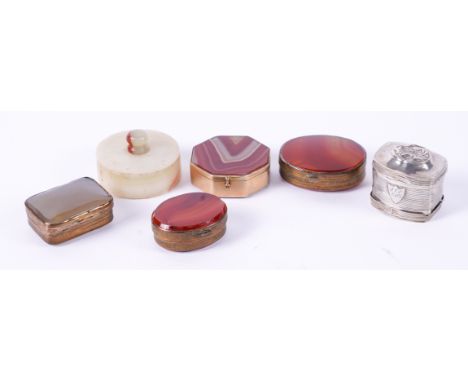 FOUR AGATE AND BRASS MOUNTED PILL BOXES AND A DUTCH SILVER DOUBLE PILL BOX (6)Possibly French or German, 20th Century The fir