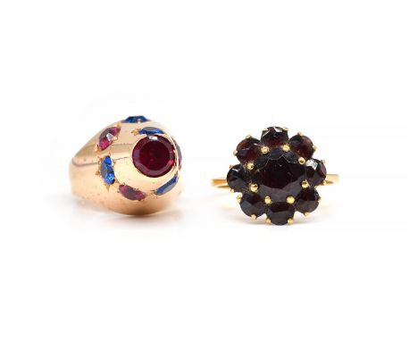 A GOLD AND GARNET NINE STONE CLUSTER RING AND A GOLD, RED AND BLUE PASTE SET RING (2)The garnet nine stone cluster ring detai