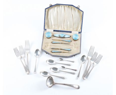 A LADIES SILVER GILT AND PALE BLUE ENAMELLED SEVEN PIECE PART MANICURE SET AND A QUANTITY OF PLATED FLATWARE (QTY)The manicur