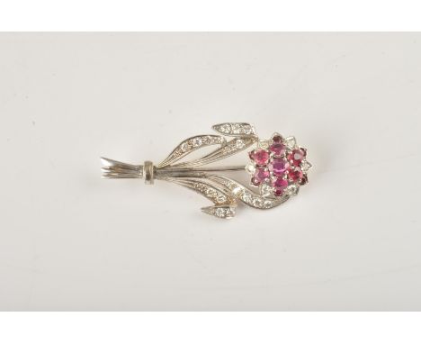 A WHITE GOLD, RUBY AND DIAMOND BROOCHDetailed Boodles 9 CT, designed as a floral spray, mounted with variously cut rubies and