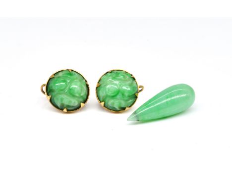 A PAIR OF JADE EARRINGS AND A JADE DROP PENDANT (2)Each jade earring of circular form with carved decoration, the mounts unma