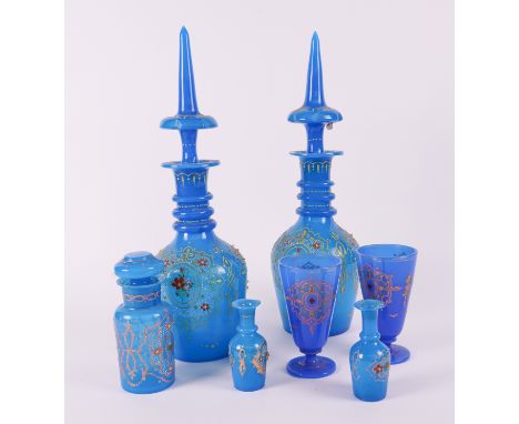 A PAIR OF BOHEMIAN OPAQUE BLUE GLASS DECANTERS WITH STOPPERS, A PAIR OF SMALL VASES AND A PAIR OF GOBLETS (7)For the Persian 
