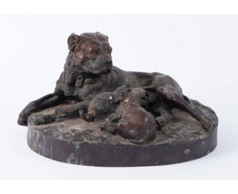 A BRONZE RESIN GROUP OF A DOG AND TWO PUPPIES20th CenturyCast on an oval base, signed W W O, 36cm wide