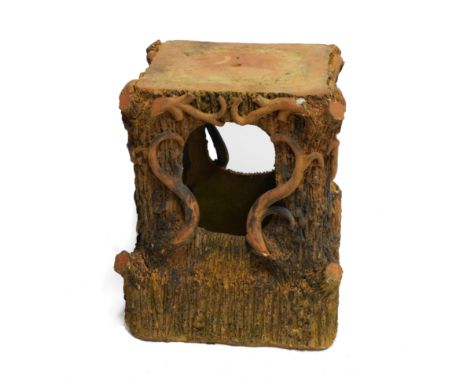A TERRACOTTA PLINTH OF NATURALISTIC FORM20th CenturyDesigned as a tree stump enveloped in twisting vines, 40cm wide; 53cm hig