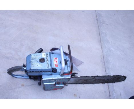 A LARGE HEAVY DUTY HOMELITE PETROL CHAINSAW