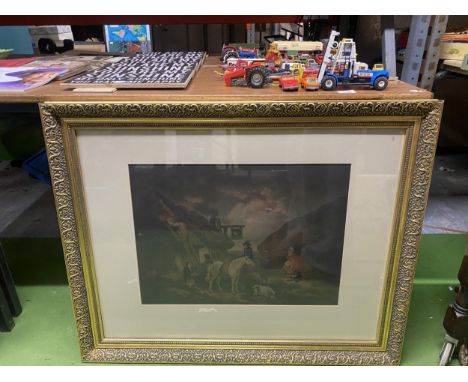 A LARGE GILT FRAMED PRINT OF A VINTAGE COUNTRY INN BEING THATCHED,  88CM X 69CM