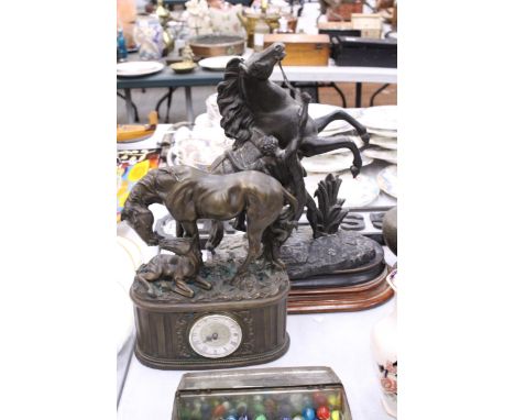 A BRONZE EFFECT MANTLE CLOCK OF A HORSE AND FOAL TOGETHER WITH A SPELTER MAN AND MARLY HORSE SCULPTURE
