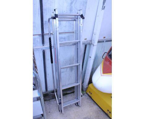 AN ALUMINIUM THREE SECTION PULL OUT LOFT LADDER