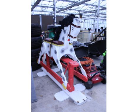 A WOODEN PAINTED ROCKING HORSE