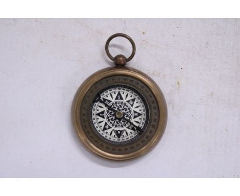A BRASS COMPASS