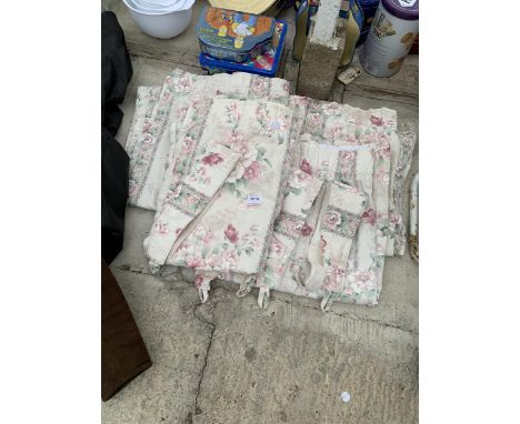 A PAIR OF FLORAL CURTAINS AND TIE BACKS