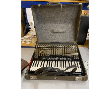 A VINTAGE HOHNER ATLANTIC PIANO ACCORDIAN IN A CASE