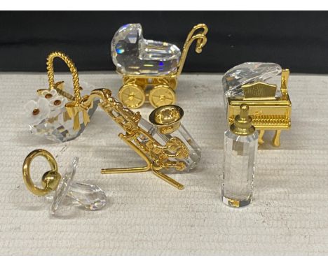 SIX SWAROVSKI CRYSTAL ITEMS TO INCLUDE A PRAM, PIANO, BASKET OF FLOWERS, BABY'S BOTTLE AND DUMMY AND A SAXOPHONE