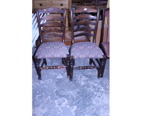 A PAIR OF ELM LANCASHIRE STYLE LADDER BACK DINING CHAIRS